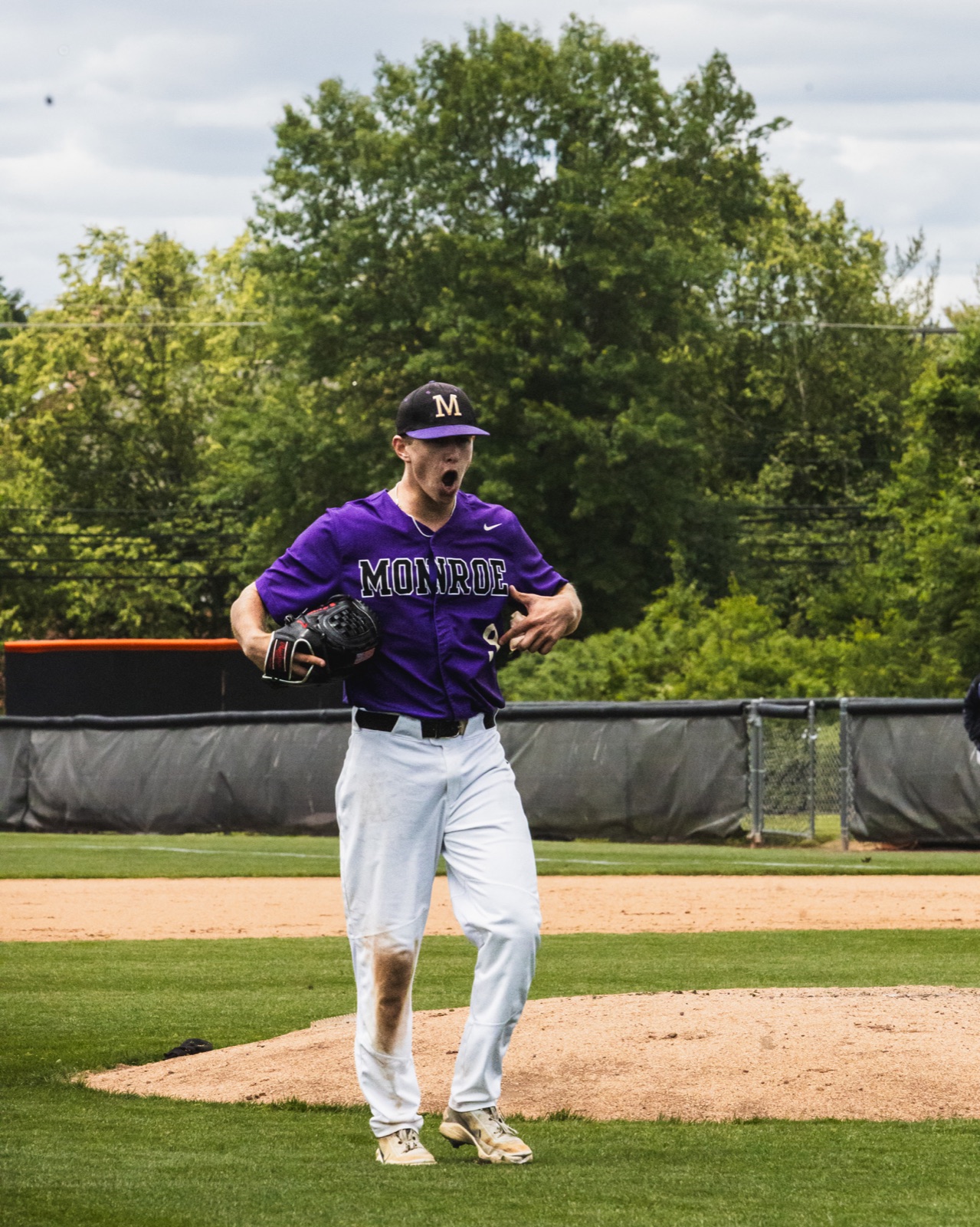 Monroe baseball pitcher celebrating on the mound