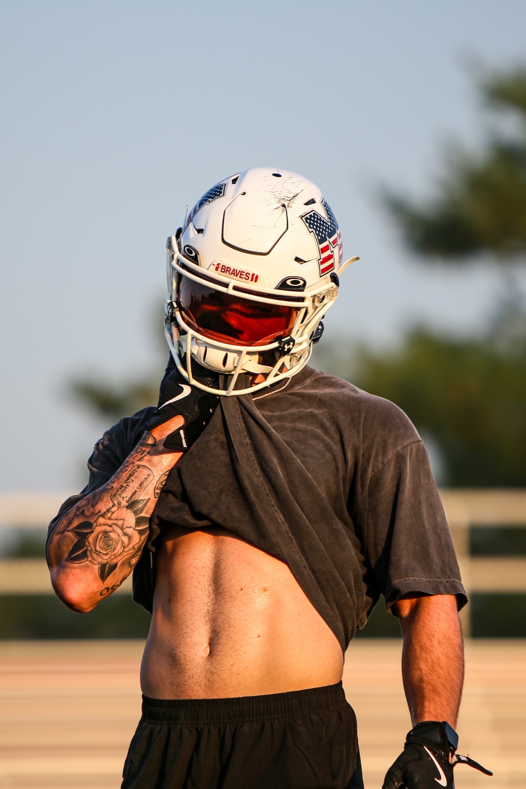 Football athlete in a helmet between plays